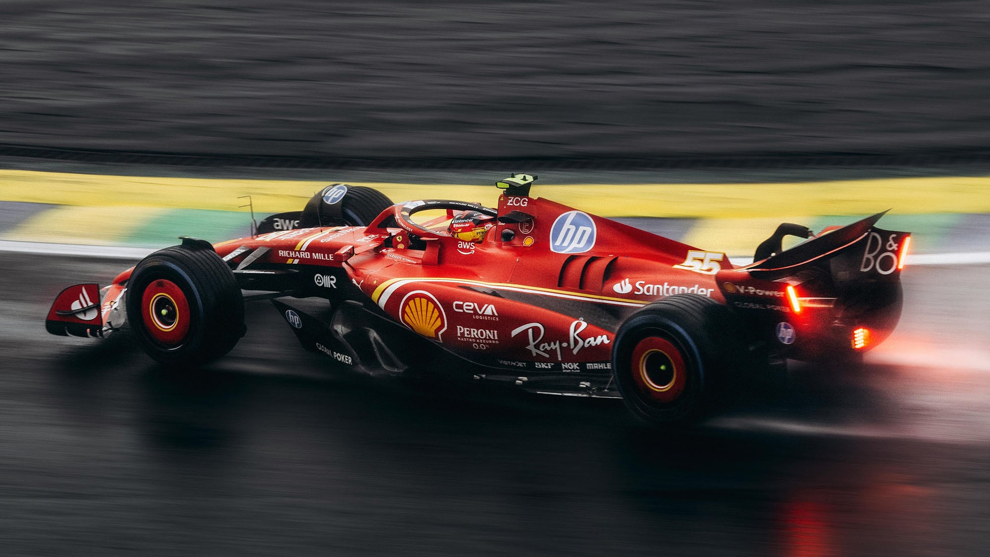 Formula 1 car racing on a wet track